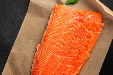 Salmon fillet raw red fish seafood dish natural tasty snack fresh delicious gourmet food background on the table rustic top view copy space pescetarian diet