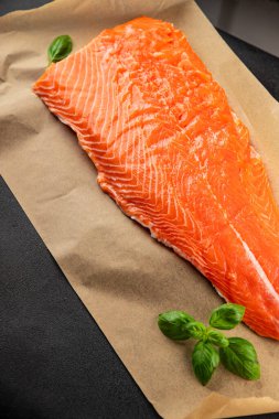 Salmon fillet raw red fish seafood dish natural tasty snack fresh delicious gourmet food background on the table rustic top view copy space pescetarian diet
