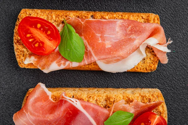 jamon bruschetta prosciutto appetizer portioned tapas dish natural tasty snack fresh delicious gourmet food background on the table rustic top view copy space