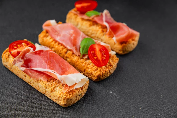 jamon bruschetta prosciutto appetizer portioned tapas dish natural tasty snack fresh delicious gourmet food background on the table rustic top view copy space