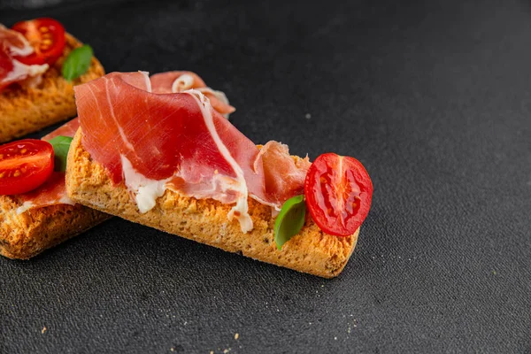 jamon bruschetta prosciutto appetizer portioned tapas dish natural tasty snack fresh delicious gourmet food background on the table rustic top view copy space