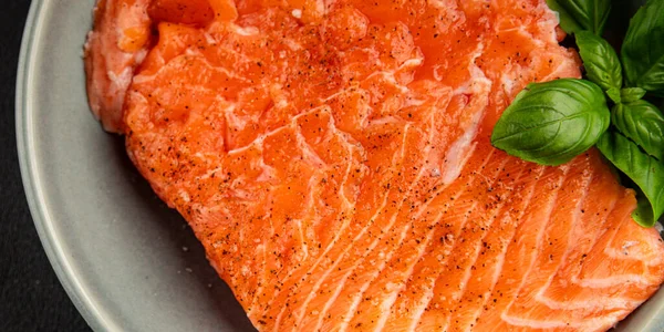 Salmon fillet raw red fish seafood dish natural tasty snack fresh delicious gourmet food background on the table rustic top view copy space pescetarian diet