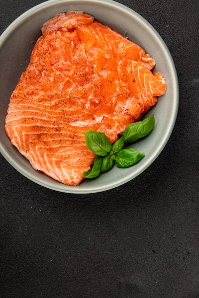 Salmon fillet raw red fish seafood dish natural tasty snack fresh delicious gourmet food background on the table rustic top view copy space pescetarian diet