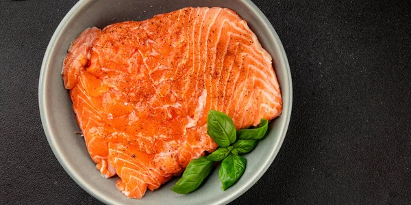 Salmon fillet raw red fish seafood dish natural tasty snack fresh delicious gourmet food background on the table rustic top view copy space pescetarian diet