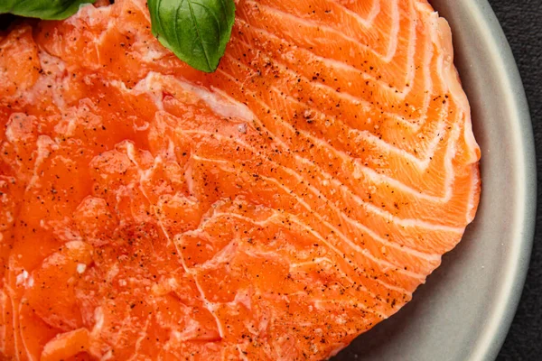 Salmon fillet raw red fish seafood dish natural tasty snack fresh delicious gourmet food background on the table rustic top view copy space pescetarian diet