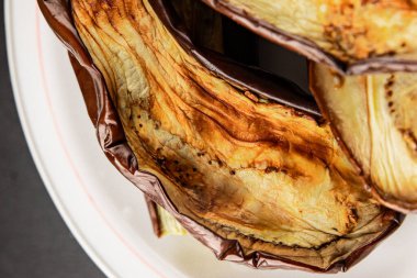 Baked eggplant grilled vegetables fresh natural product tasty snack delicious gourmet food background on the table rustic top view copy space keto and paleo diet vegan and vegan food