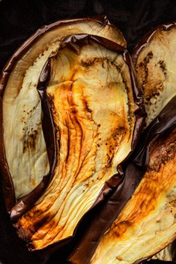Baked eggplant grilled vegetables fresh natural product tasty snack delicious gourmet food background on the table rustic top view copy space keto and paleo diet vegan and vegan food