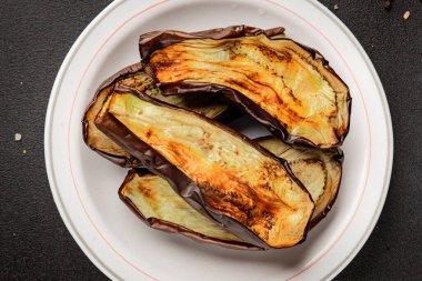Baked eggplant grilled vegetables fresh natural product tasty snack delicious gourmet food background on the table rustic top view copy space keto and paleo diet vegan and vegan food