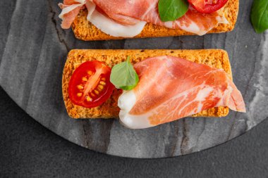jamon bruschetta prosciutto appetizer portioned tapas dish natural tasty snack fresh delicious gourmet food background on the table rustic top view copy space