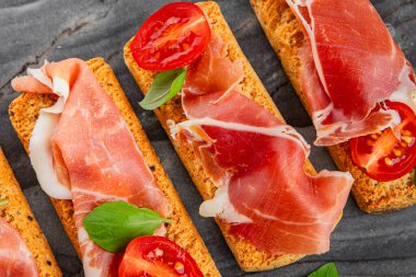 jamon bruschetta prosciutto appetizer portioned tapas dish natural tasty snack fresh delicious gourmet food background on the table rustic top view copy space