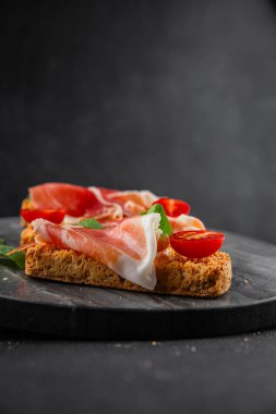 jamon bruschetta prosciutto appetizer portioned tapas dish natural tasty snack fresh delicious gourmet food background on the table rustic top view copy space