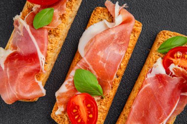 jamon bruschetta prosciutto appetizer portioned tapas dish natural tasty snack fresh delicious gourmet food background on the table rustic top view copy space