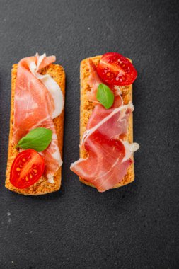 jamon bruschetta prosciutto appetizer portioned tapas dish natural tasty snack fresh delicious gourmet food background on the table rustic top view copy space