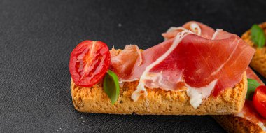 jamon bruschetta prosciutto appetizer portioned tapas dish natural tasty snack fresh delicious gourmet food background on the table rustic top view copy space