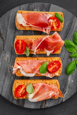 jamon bruschetta prosciutto appetizer portioned tapas dish natural tasty snack fresh delicious gourmet food background on the table rustic top view copy space