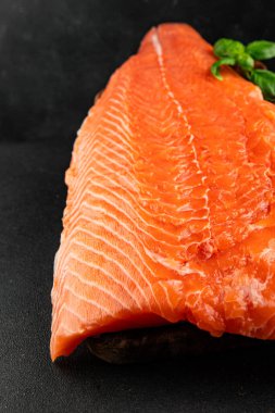 Salmon fillet raw red fish seafood dish natural tasty snack fresh delicious gourmet food background on the table rustic top view copy space pescetarian diet