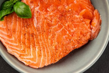 Salmon fillet raw red fish seafood dish natural tasty snack fresh delicious gourmet food background on the table rustic top view copy space pescetarian diet