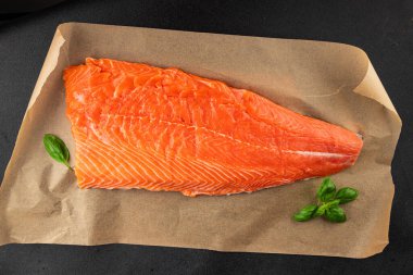 Salmon fillet raw red fish seafood dish natural tasty snack fresh delicious gourmet food background on the table rustic top view copy space pescetarian diet