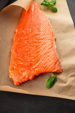 Salmon fillet raw red fish seafood dish natural tasty snack fresh delicious gourmet food background on the table rustic top view copy space pescetarian diet