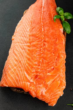 Salmon fillet raw red fish seafood dish natural tasty snack fresh delicious gourmet food background on the table rustic top view copy space pescetarian diet