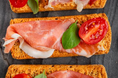 jamon bruschetta prosciutto appetizer portioned tapas dish natural tasty snack fresh delicious gourmet food background on the table rustic top view copy space