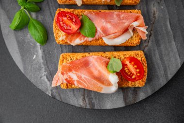 jamon bruschetta prosciutto appetizer portioned tapas dish natural tasty snack fresh delicious gourmet food background on the table rustic top view copy space