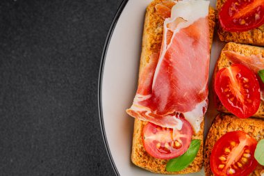 jamon bruschetta prosciutto appetizer portioned tapas dish natural tasty snack fresh delicious gourmet food background on the table rustic top view copy space