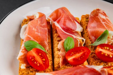 jamon bruschetta prosciutto appetizer portioned tapas dish natural tasty snack fresh delicious gourmet food background on the table rustic top view copy space