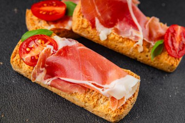 jamon bruschetta prosciutto appetizer portioned tapas dish natural tasty snack fresh delicious gourmet food background on the table rustic top view copy space