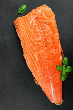 Salmon fillet raw red fish seafood dish natural tasty snack fresh delicious gourmet food background on the table rustic top view copy space pescetarian diet