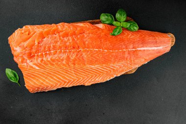 Salmon fillet raw red fish seafood dish natural tasty snack fresh delicious gourmet food background on the table rustic top view copy space pescetarian diet