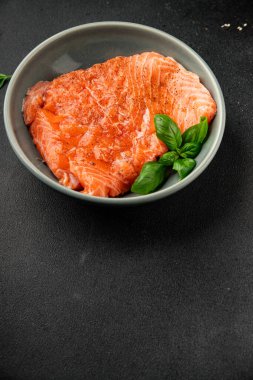 Salmon fillet raw red fish seafood dish natural tasty snack fresh delicious gourmet food background on the table rustic top view copy space pescetarian diet