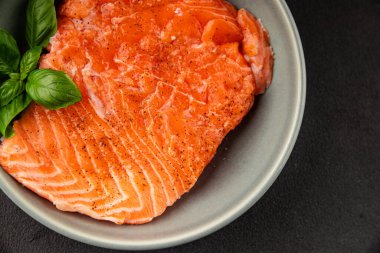 Salmon fillet raw red fish seafood dish natural tasty snack fresh delicious gourmet food background on the table rustic top view copy space pescetarian diet