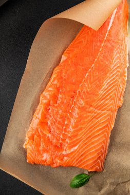 Salmon fillet raw red fish seafood dish natural tasty snack fresh delicious gourmet food background on the table rustic top view copy space pescetarian diet