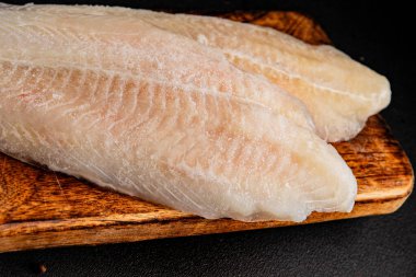 Donmuş balık fileto beyaz balık pangasius deniz ürünleri lezzetli leziz lezzetli gurme lezzetli diyet arka planı masadaki kırsal yemek üst görüşü uzay keto ve paleo diyet