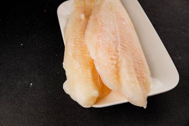 Donmuş balık fileto beyaz balık pangasius deniz ürünleri lezzetli leziz lezzetli gurme lezzetli diyet arka planı masadaki kırsal yemek üst görüşü uzay keto ve paleo diyet