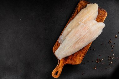 Donmuş balık fileto beyaz balık pangasius deniz ürünleri lezzetli leziz lezzetli gurme lezzetli diyet arka planı masadaki kırsal yemek üst görüşü uzay keto ve paleo diyet