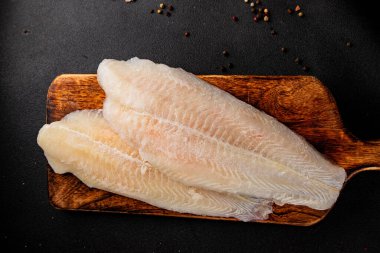 Donmuş balık fileto beyaz balık pangasius deniz ürünleri lezzetli leziz lezzetli gurme lezzetli diyet arka planı masadaki kırsal yemek üst görüşü uzay keto ve paleo diyet