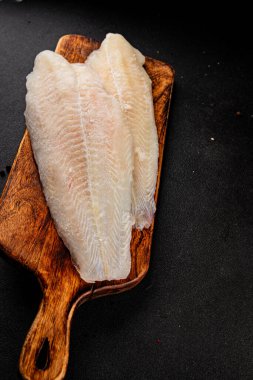Donmuş balık fileto beyaz balık pangasius deniz ürünleri lezzetli leziz lezzetli gurme lezzetli diyet arka planı masadaki kırsal yemek üst görüşü uzay keto ve paleo diyet