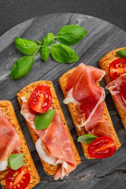 jamon bruschetta prosciutto appetizer portioned tapas dish natural tasty snack fresh delicious gourmet food background on the table rustic top view copy space