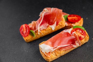 jamon bruschetta prosciutto appetizer portioned tapas dish natural tasty snack fresh delicious gourmet food background on the table rustic top view copy space