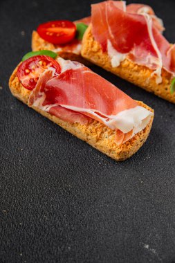 jamon bruschetta prosciutto appetizer portioned tapas dish natural tasty snack fresh delicious gourmet food background on the table rustic top view copy space