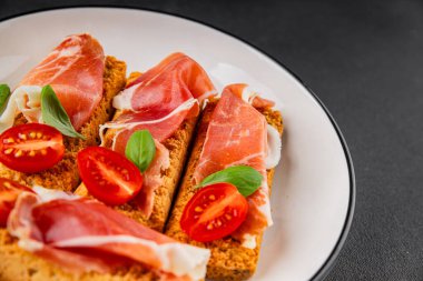 jamon bruschetta prosciutto appetizer portioned tapas dish natural tasty snack fresh delicious gourmet food background on the table rustic top view copy space