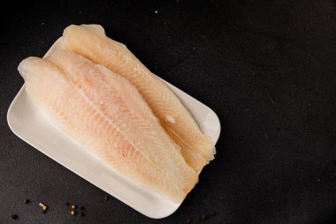 Donmuş balık fileto beyaz balık pangasius deniz ürünleri lezzetli leziz lezzetli gurme lezzetli diyet arka planı masadaki kırsal yemek üst görüşü uzay keto ve paleo diyet