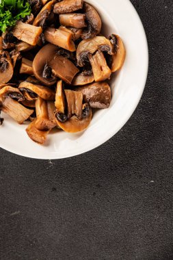 Champignon mantarları lezzetli atıştırmalıklar yemeye hazır taze gurme yemek arkaplanı masanın üstünde rustik yemek fotokopi alanı keto ve paleo diyet vejetaryen ve vejetaryen gıda pazarlama konsepti fotoğrafı