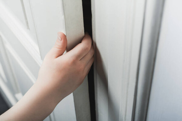 Child Fingers From Being Bruised Without Door Stopper Protection - Prevent Child Hazard Concept