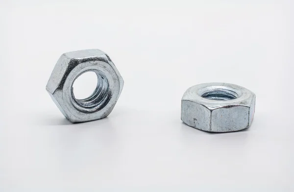 Macro Shot of Two Lying Iron Nuts — Stock Photo, Image