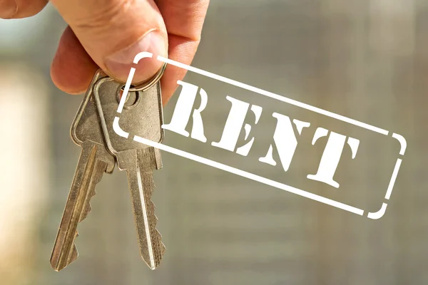 Stempel "huur" en het huis sleutels — Stockfoto