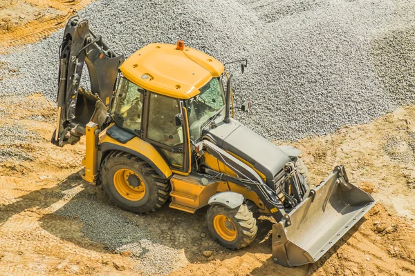 A versatile machine with the functions of excavator and bulldozer — Stock Photo, Image