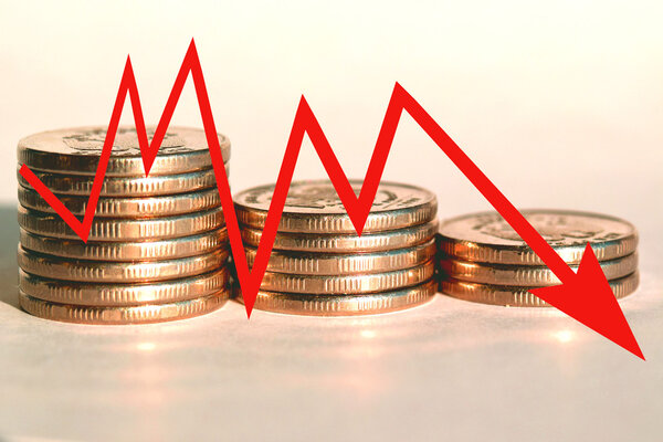 A red arrow - graph on a background of money . 